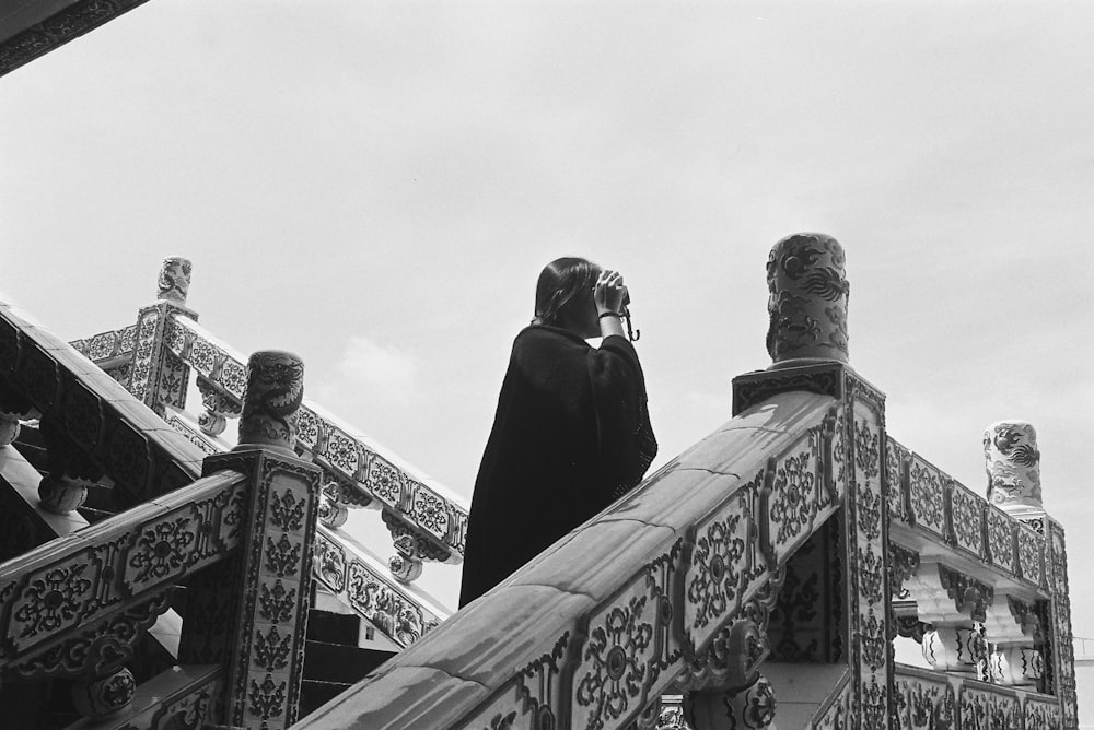 a couple of people that are standing on some stairs