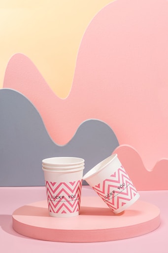 two cups of coffee sitting on top of a table