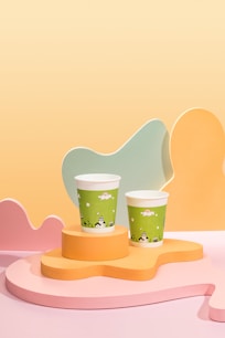 a couple of cups sitting on top of a table