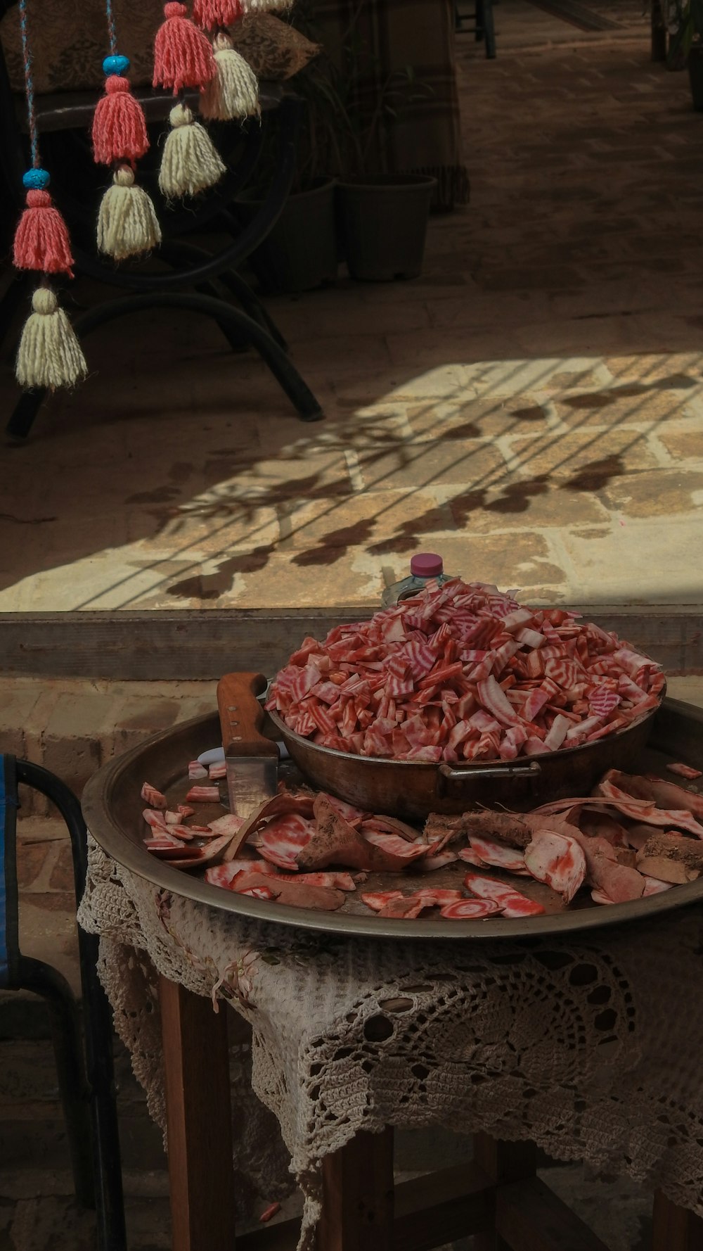 a table with a bowl of meat on top of it