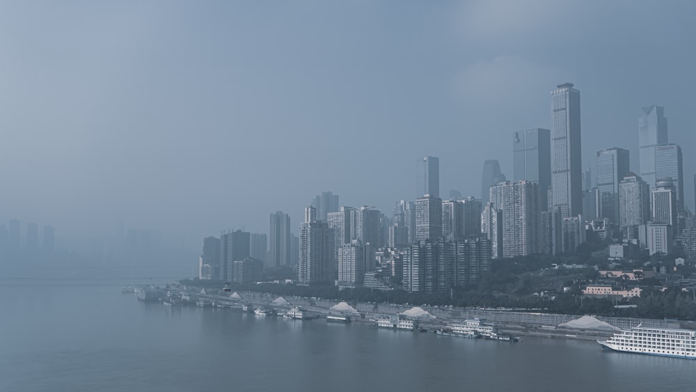 a large body of water with a city in the background