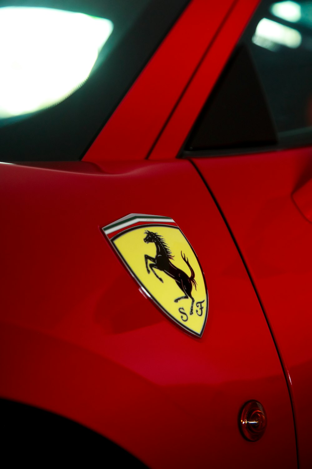 a close up of a red sports car