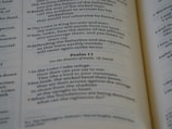 Close-up of an open Bible with sunlight illuminating the pages.