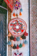 Close-up of a handcrafted wall art piece showcasing intricate designs and vibrant colors.