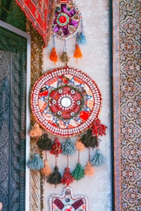 Close-up of a handcrafted wall art piece showcasing intricate designs and vibrant colors.