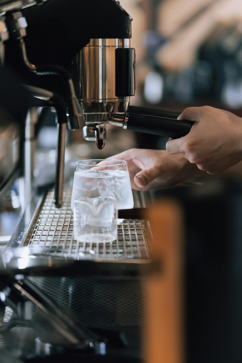 a person is filling a glass with ice