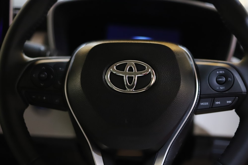 a close up of a steering wheel of a car