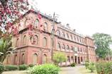 a large red brick building with lots of windows