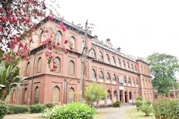 a large red brick building with lots of windows