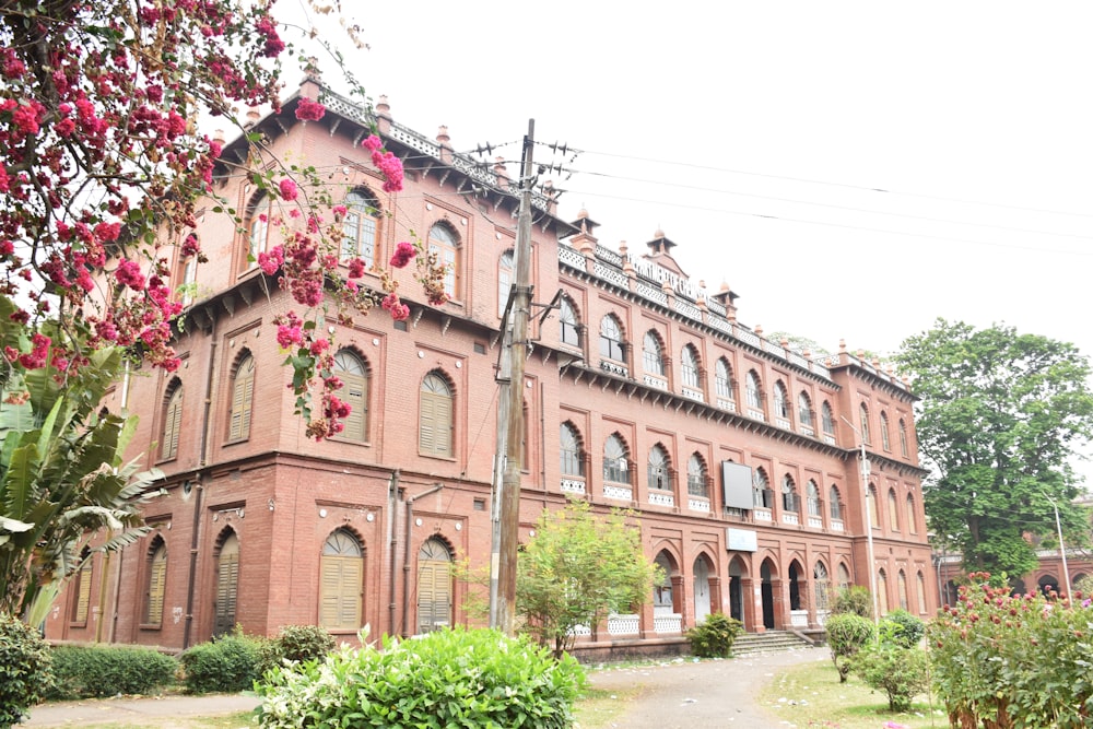 a large red brick building with lots of windows