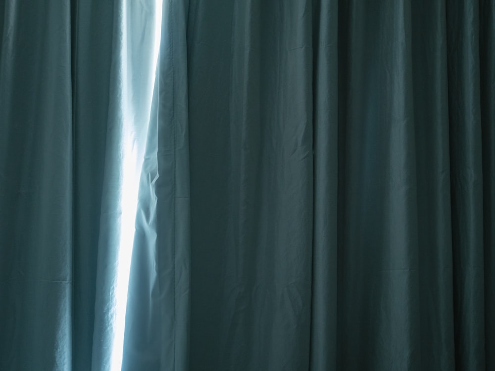 a curtain with a light coming through it