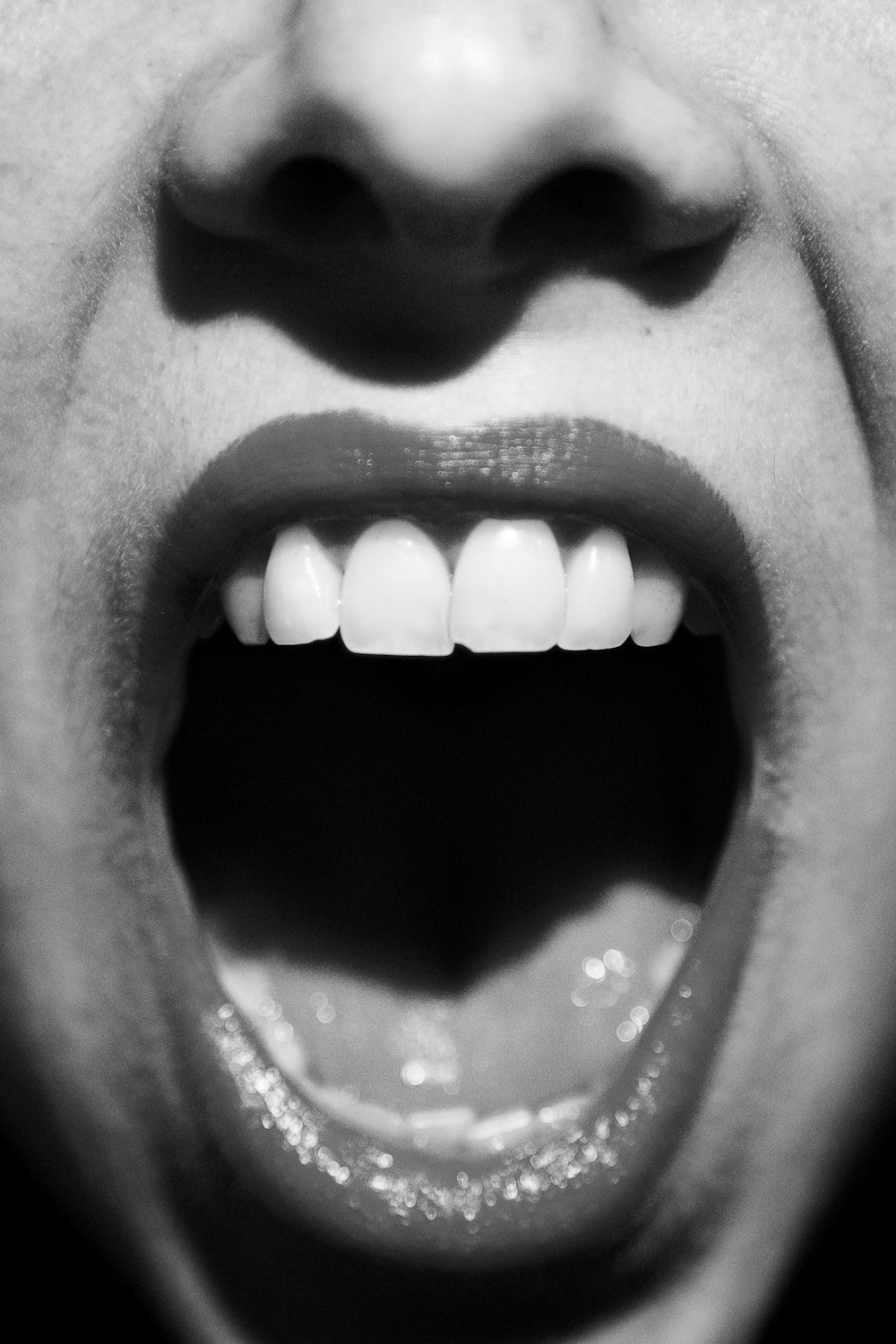 a close up of a person with their mouth open