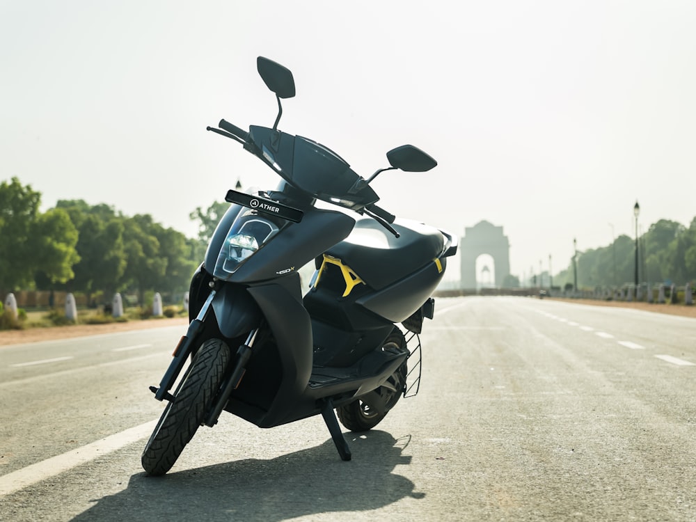 a scooter is parked on the side of the road