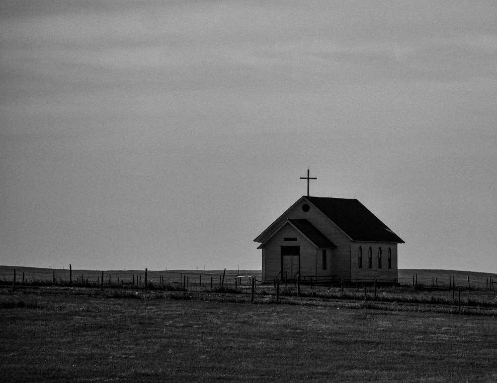 a black and white photo of a small church