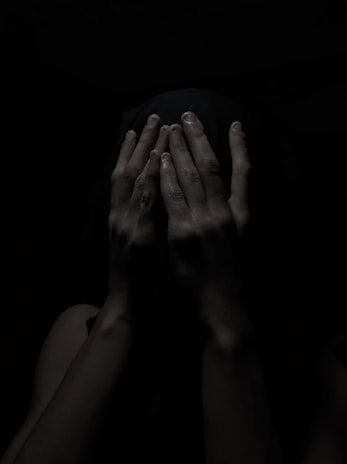 A shadowy figure in a dark alley, symbolizing secrecy and confidentiality.