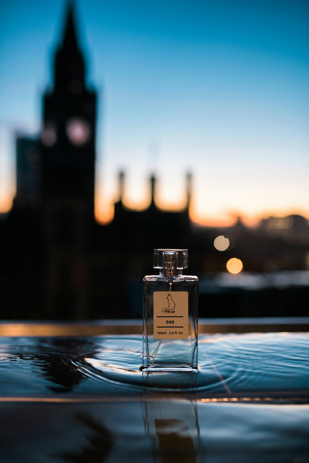 a bottle of perfume sitting on top of a table