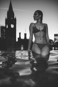 a woman in a bikini standing in the water