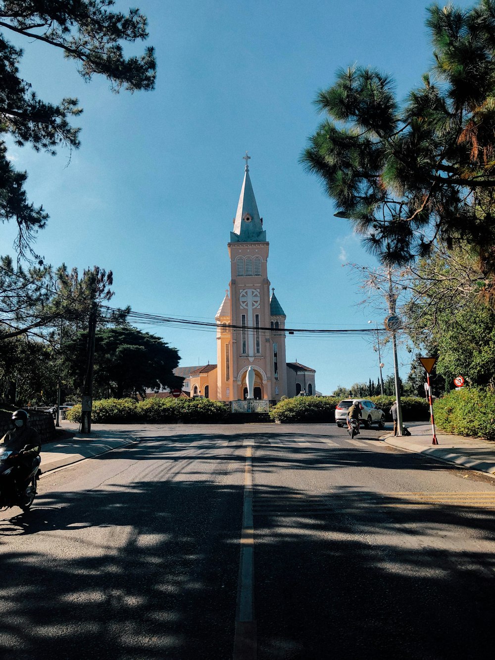 a church with a steeple on a sunny day