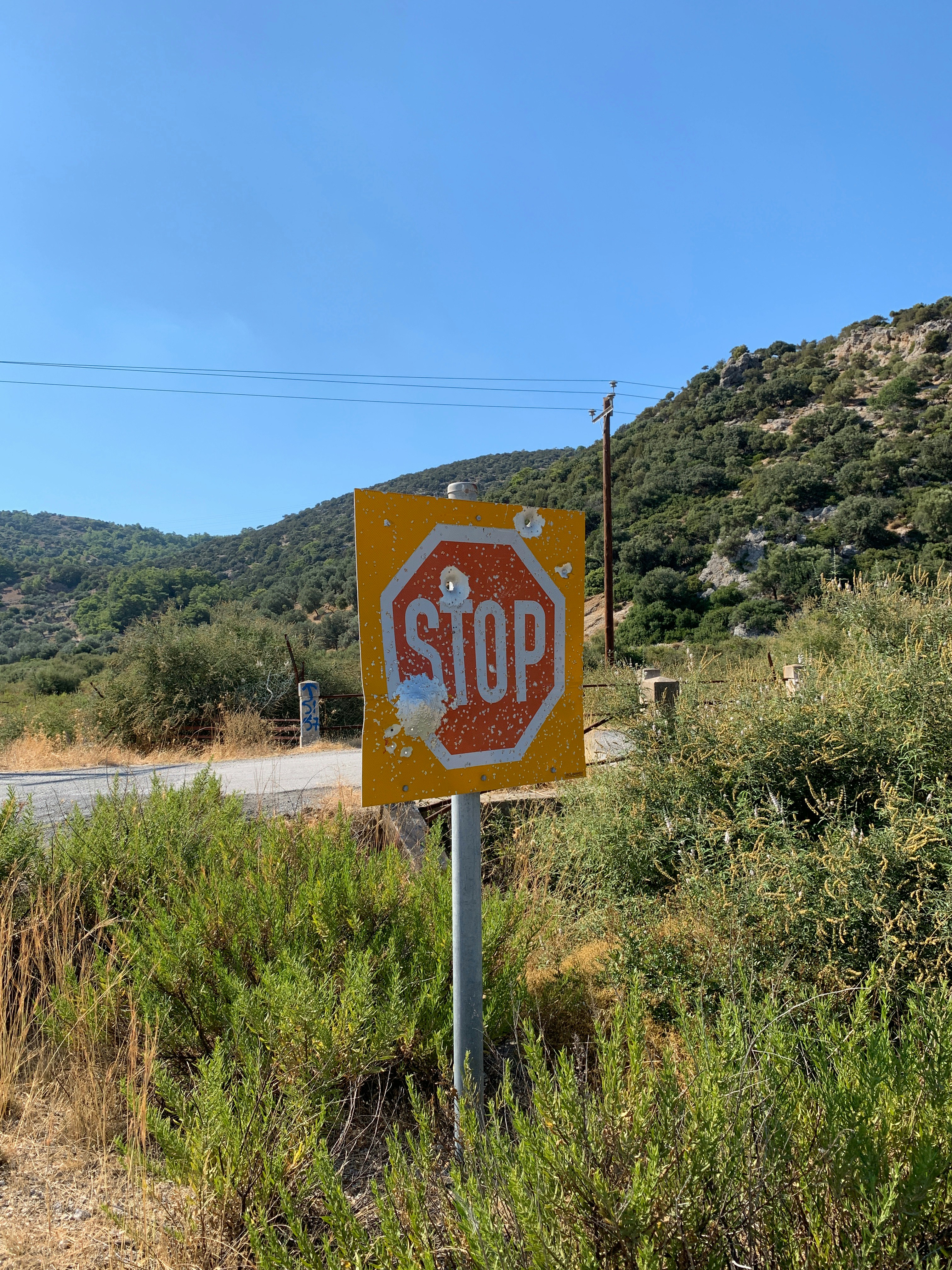 a stop sign on the side of the road