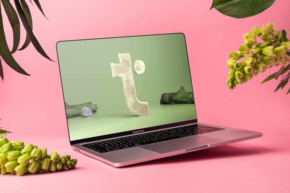 a laptop computer sitting on top of a table