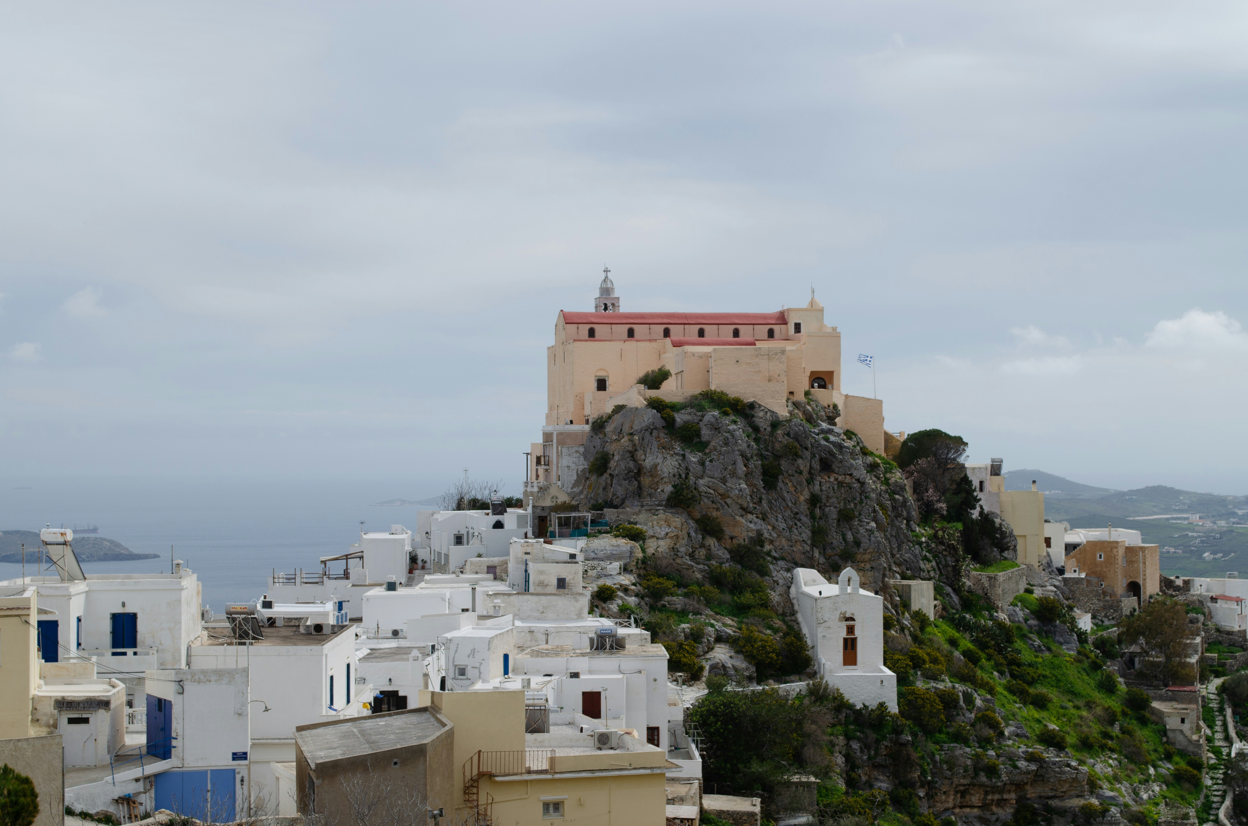 a view of a city with a castle on top of a hill, 