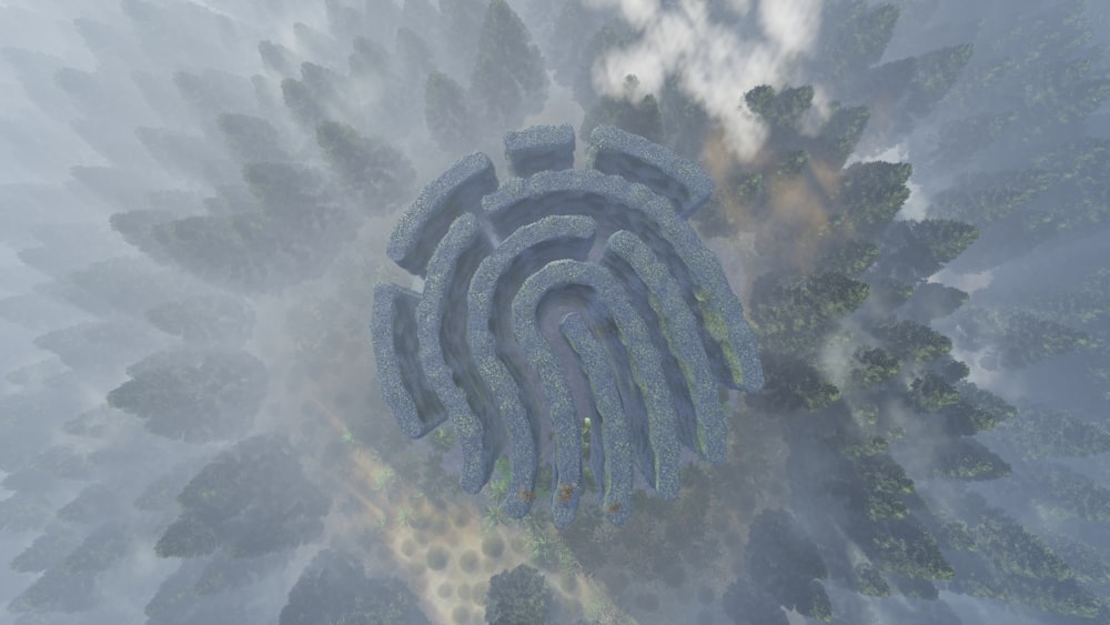 an aerial view of a maze in the middle of a forest