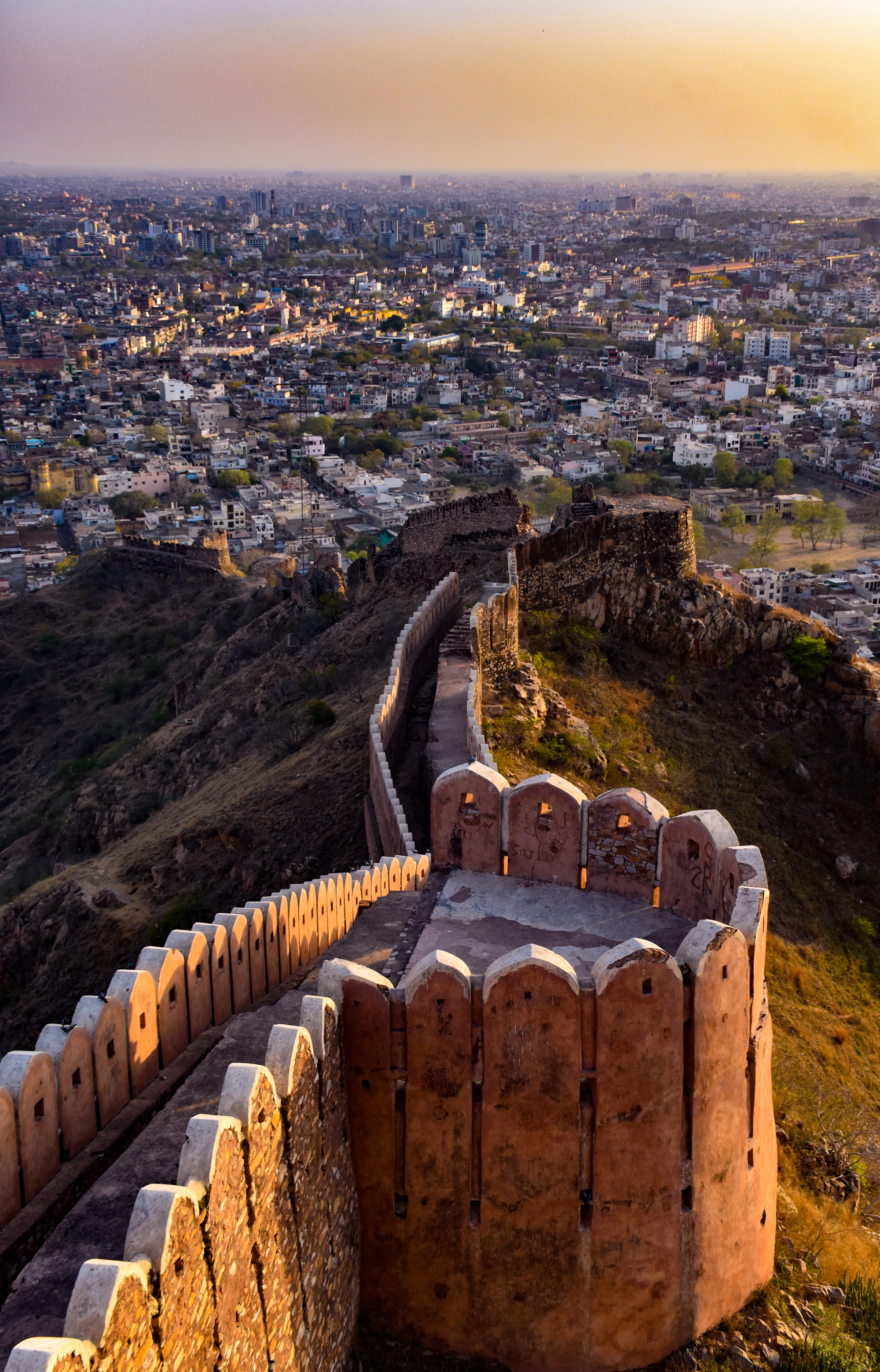 The ramparts of Nahargarh Fort winding down the Aravalli ridge above Jaipur city