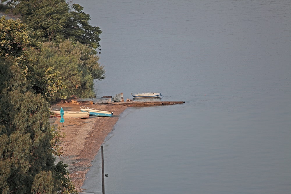 a body of water with boats on the shore