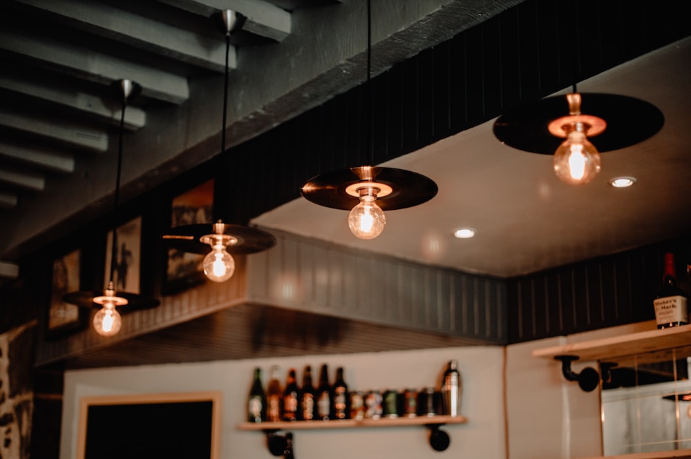 a group of lights hanging from the ceiling of a restaurant