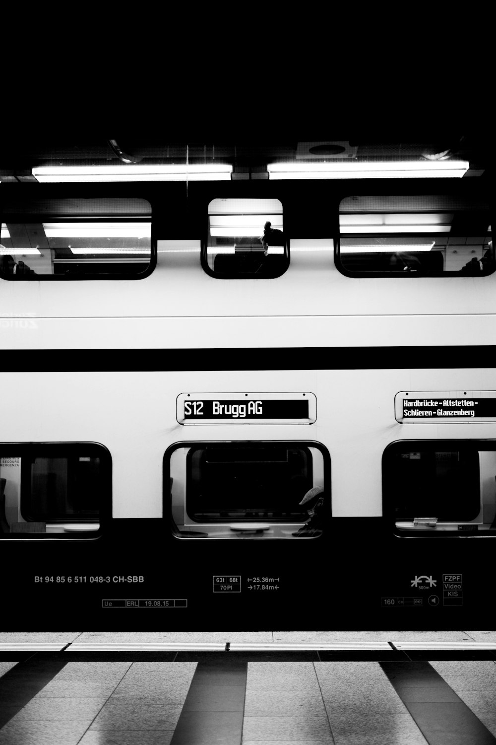a black and white photo of a subway car