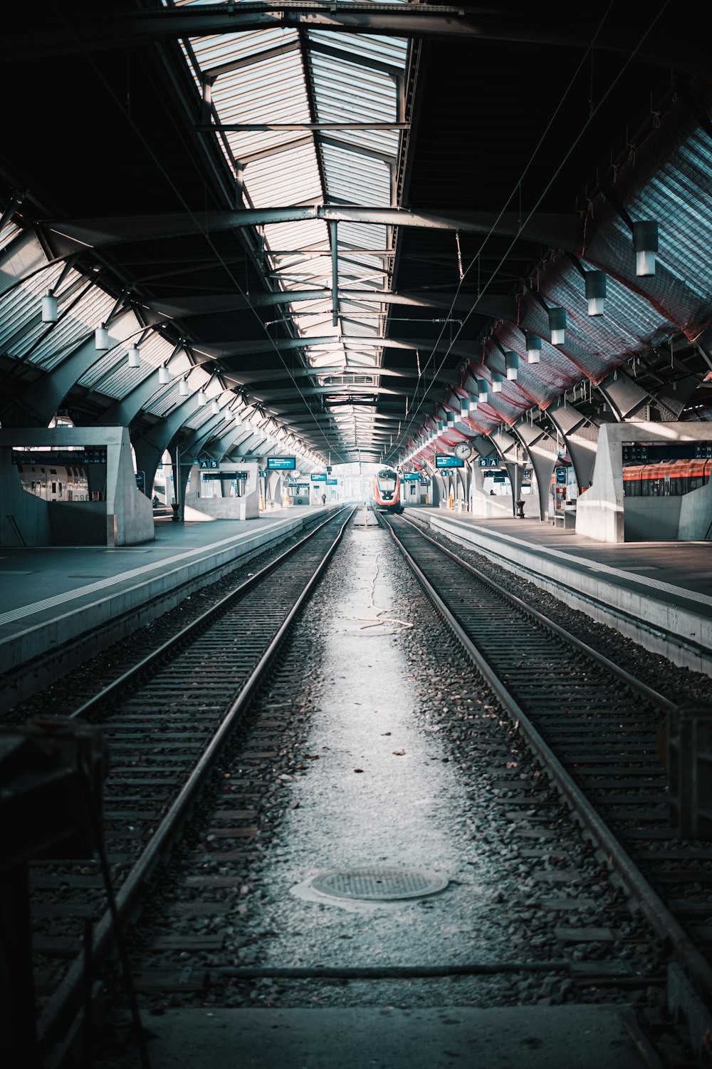 a train station with a train on the tracks