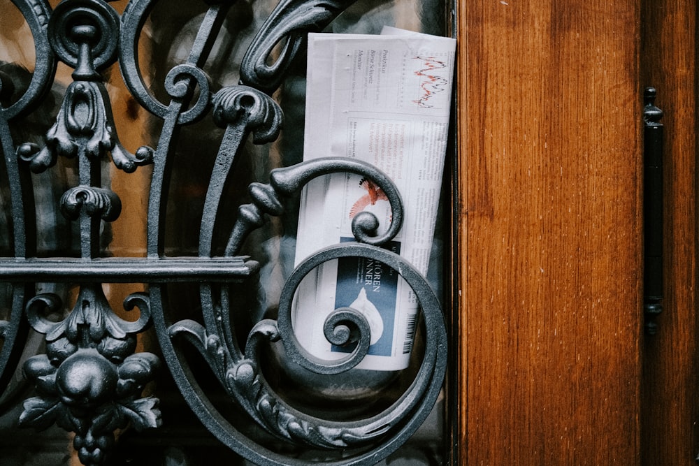 a piece of paper sitting on top of a wooden door