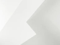 Abstract lines and shapes forming a minimal sock hint against an off-white background with asymmetrical color blocking.