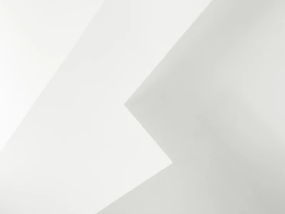 Clean geometric lines forming a subtle tech-inspired pattern in gentle white and gray.