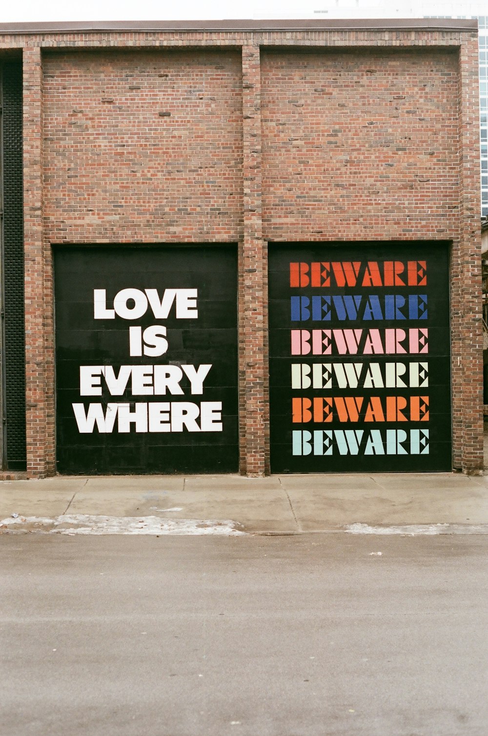 a couple of garage doors that have some words on them