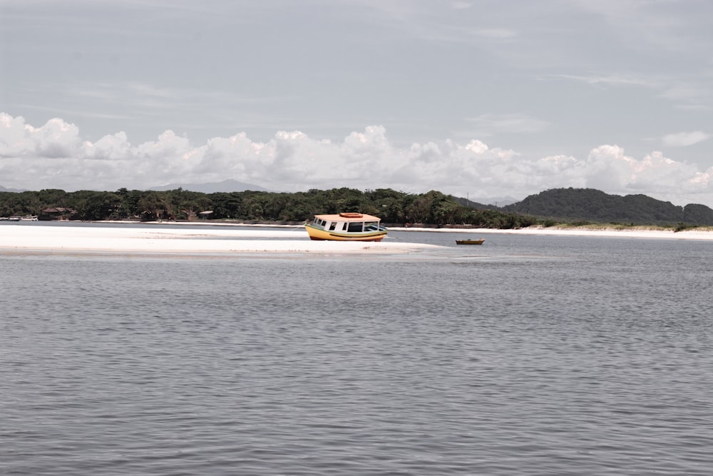 a small boat traveling across a large body of water