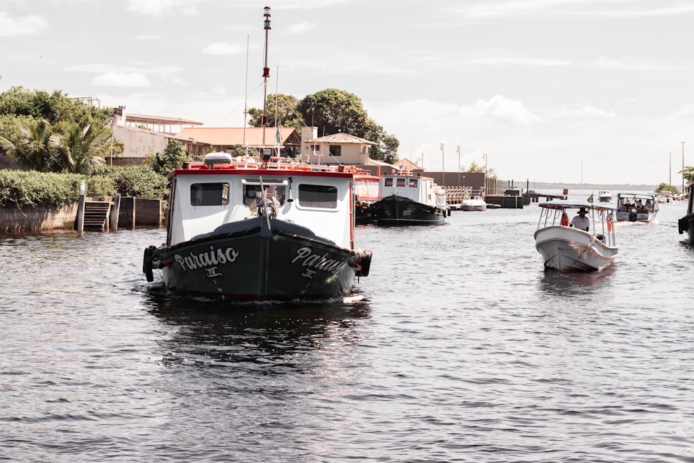 a group of boats floating on top of a river