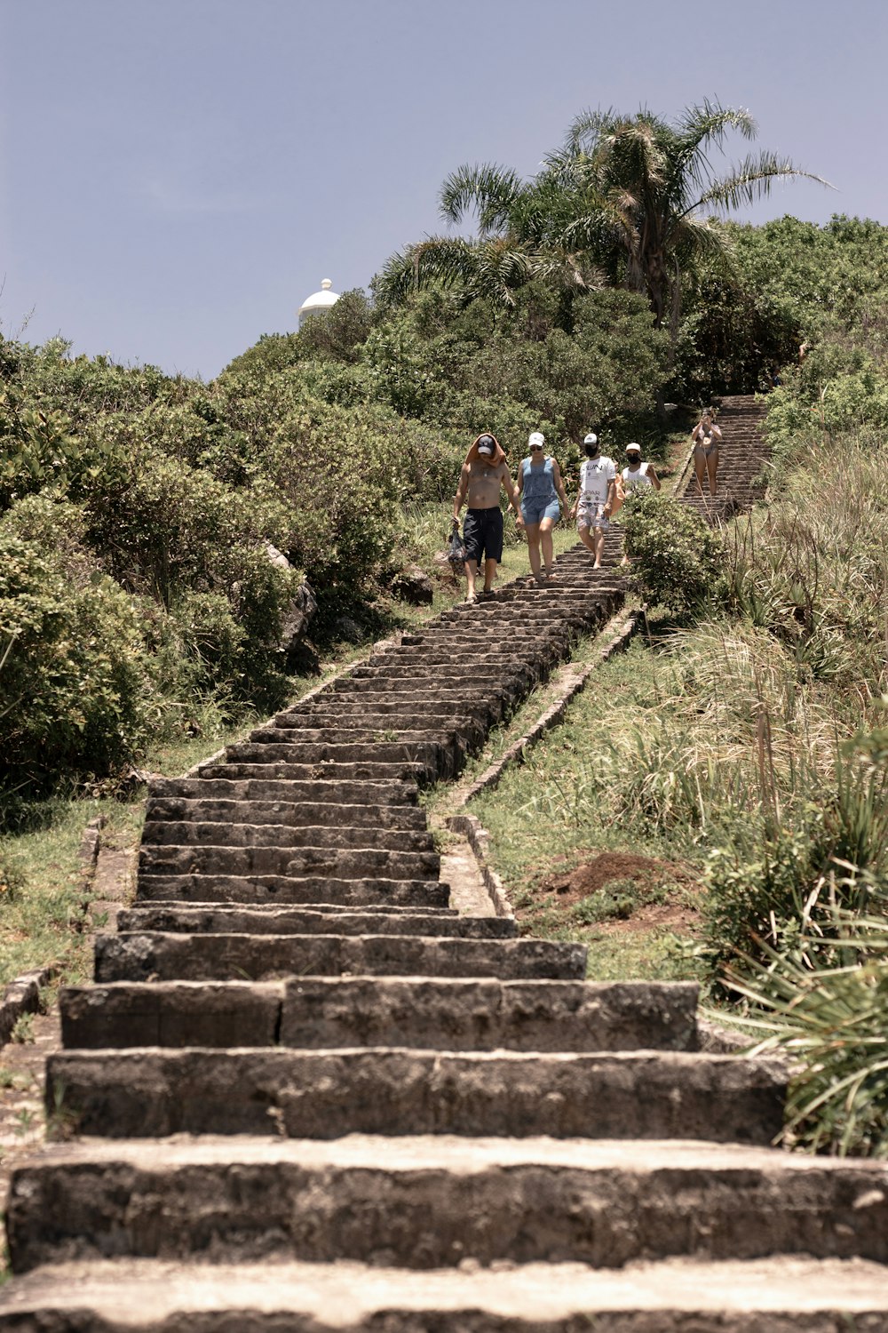 a group of people walking up a set of stairs