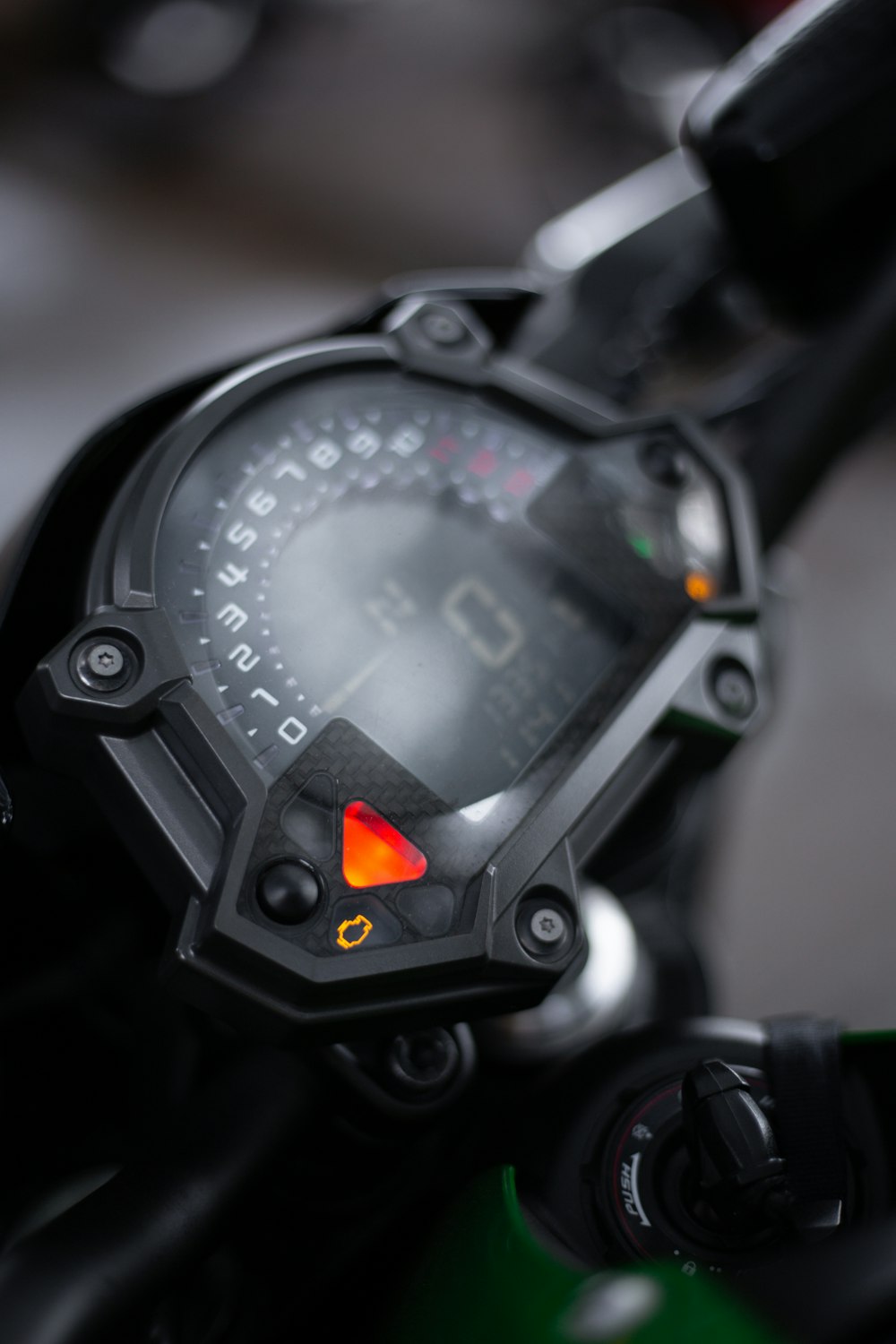 a close up of a speedometer on a motorcycle