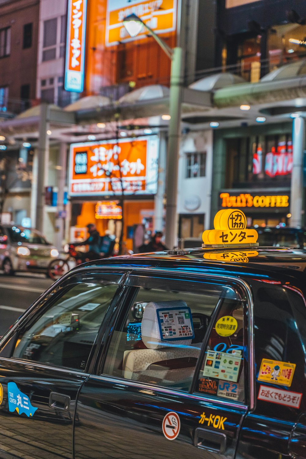 a taxi cab parked on the side of the road