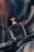 a bottle of nautica on a blanket