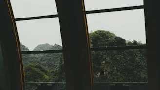 A team discussing project plans with a mountain view through the window.