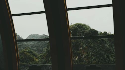 A team discussing project plans with a mountain view through the window.