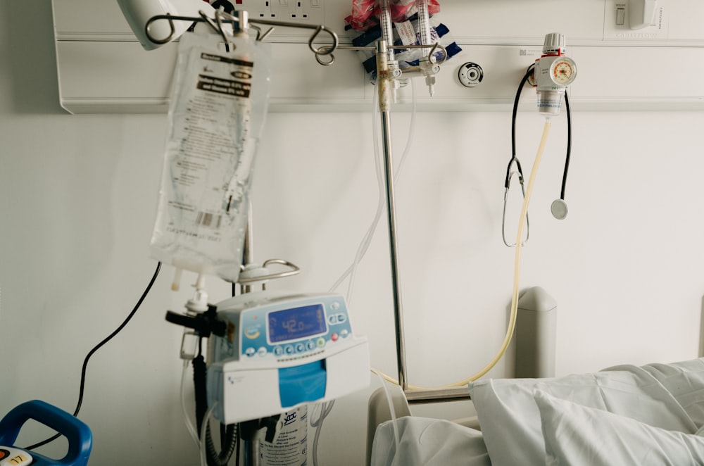 a hospital room with a bed and medical equipment