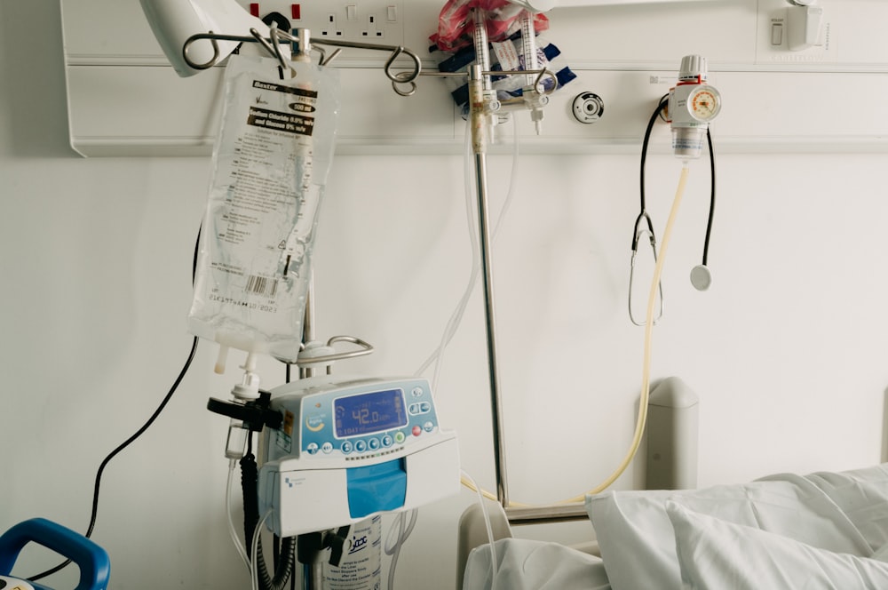 a hospital room with a bed and medical equipment