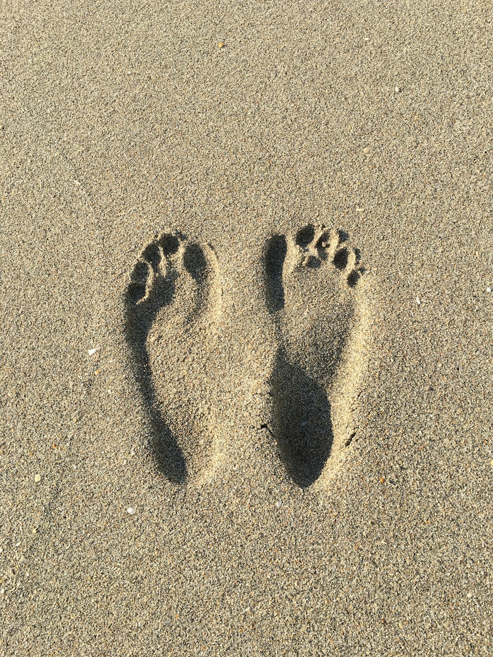 a close up of a person's footprints in the sand