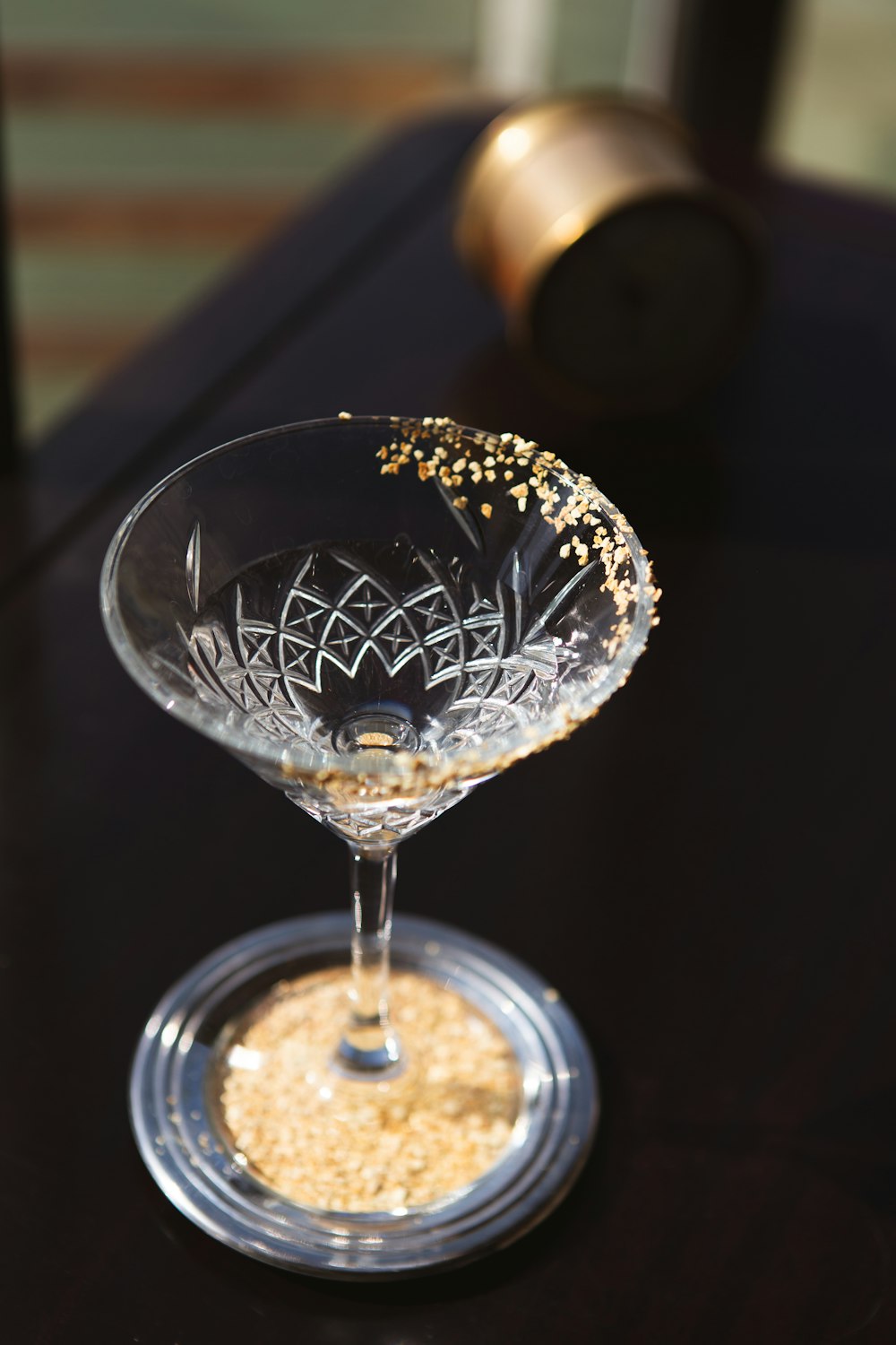 a wine glass sitting on top of a table