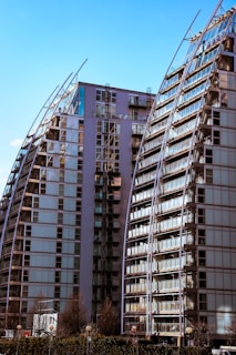 a very tall building sitting next to a very tall building
