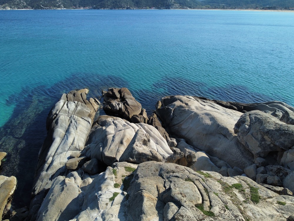 a large body of water surrounded by rocks