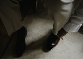 A professional setting with a person wearing elegant leather shoes.